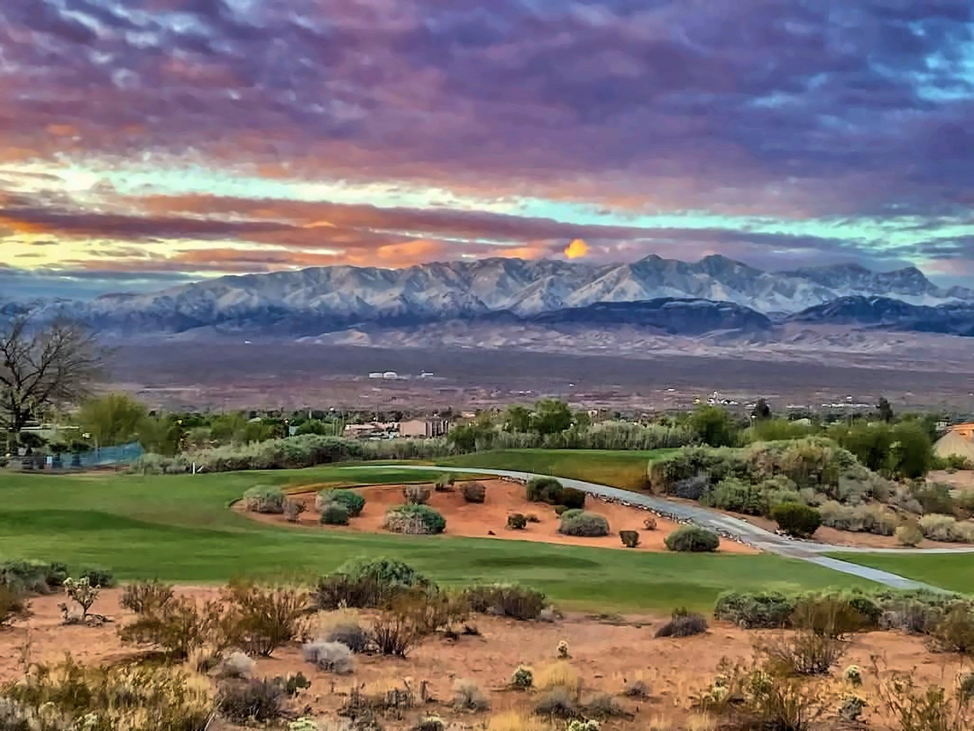 Sunset over a golf course and the Virgin Mountains in Mesquite, Nevada